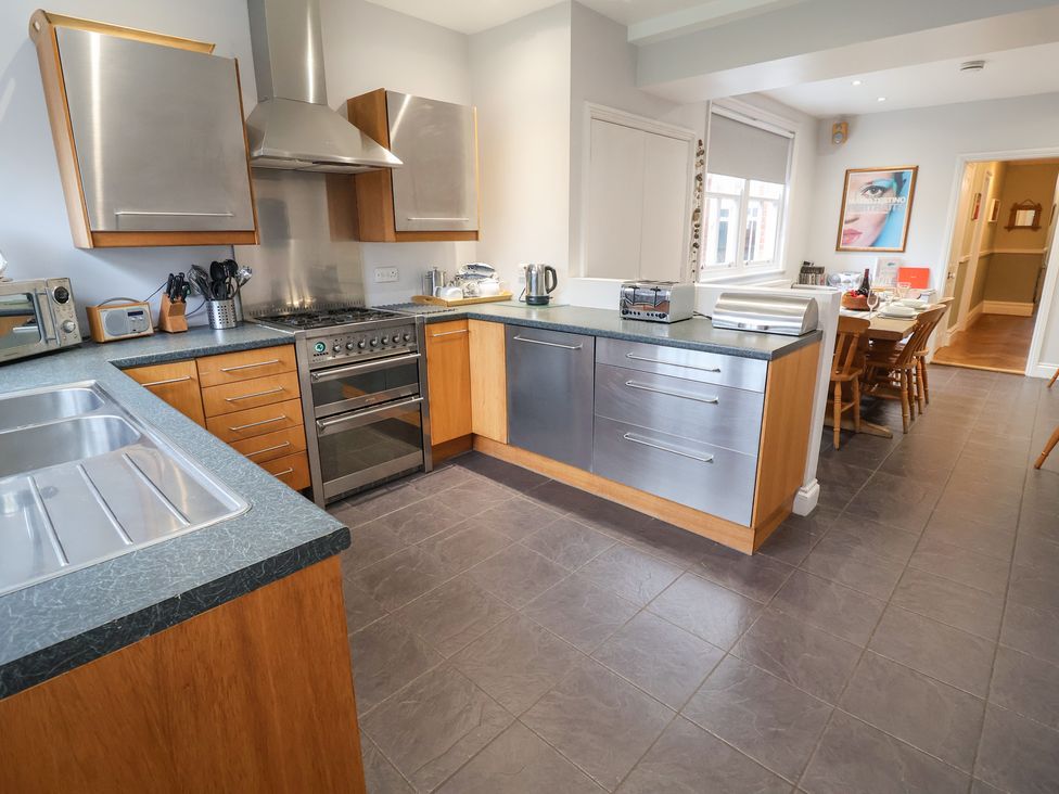 A kitchen with cabinets and appliances at Lavender House, Aldeburgh