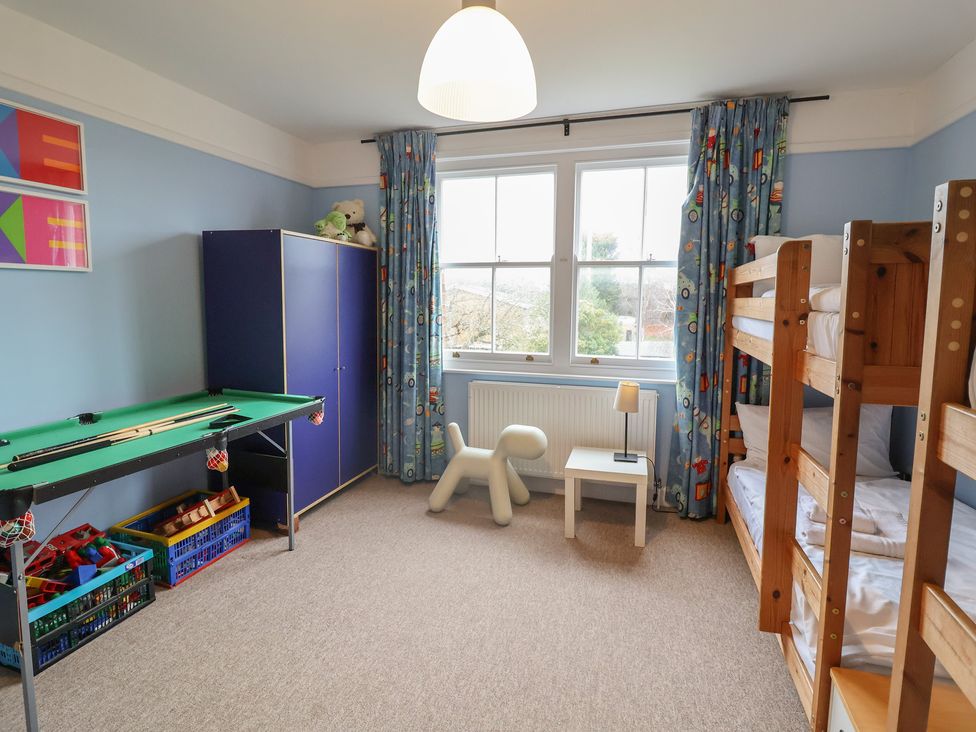 A children's bedroom with a bunk bed and pool table at Lavender House, Aldeburgh