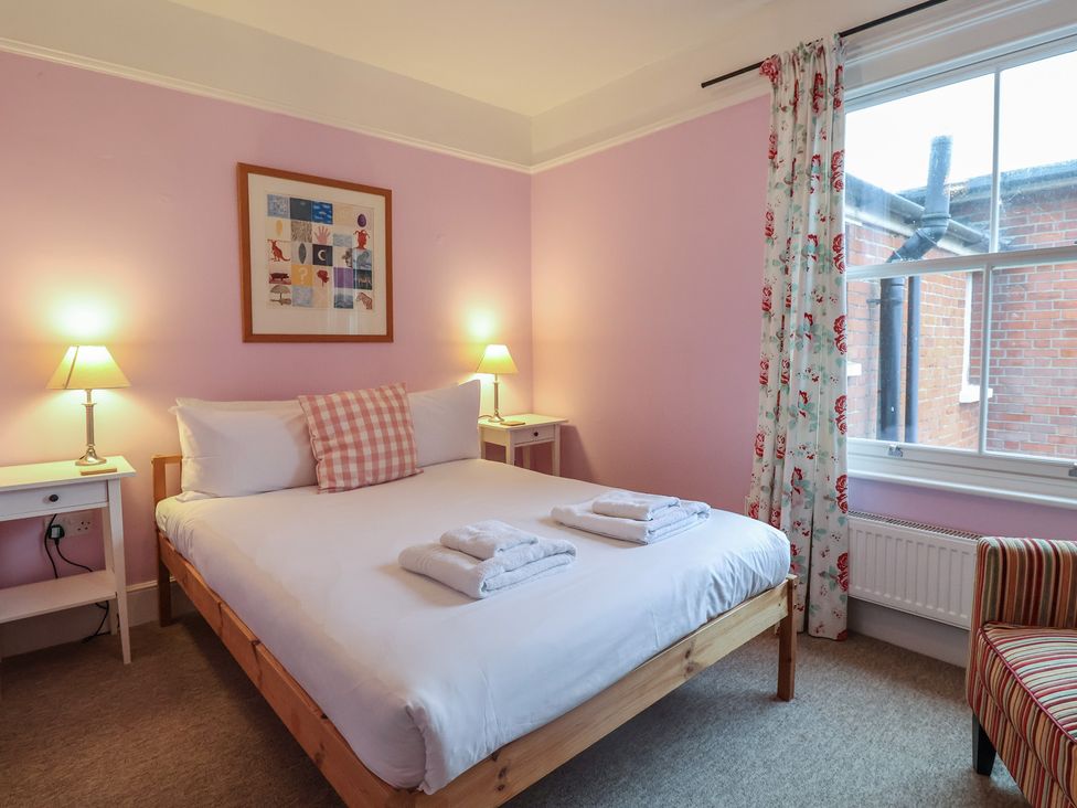 A bedroom with a bed and bedside tables at Lavender House, Aldeburgh