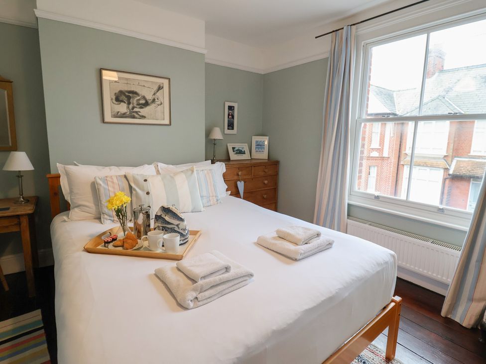 A bedroom with a bed and tray on it at Lavender House, Aldeburgh