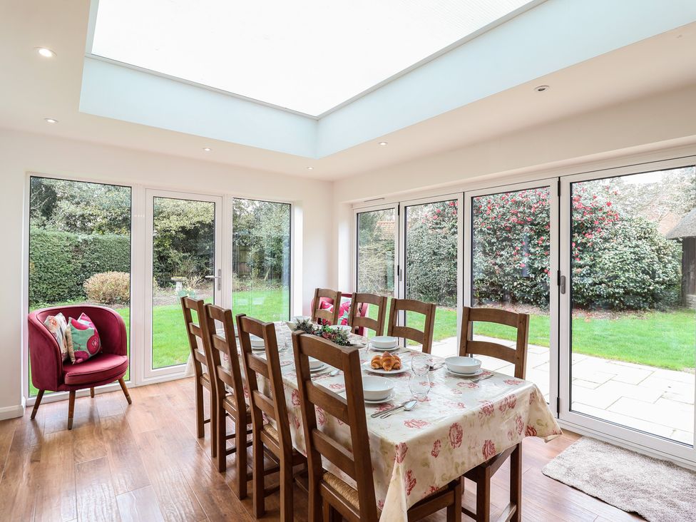 A dining room with a table set for meals at Rippleway, Walberswick