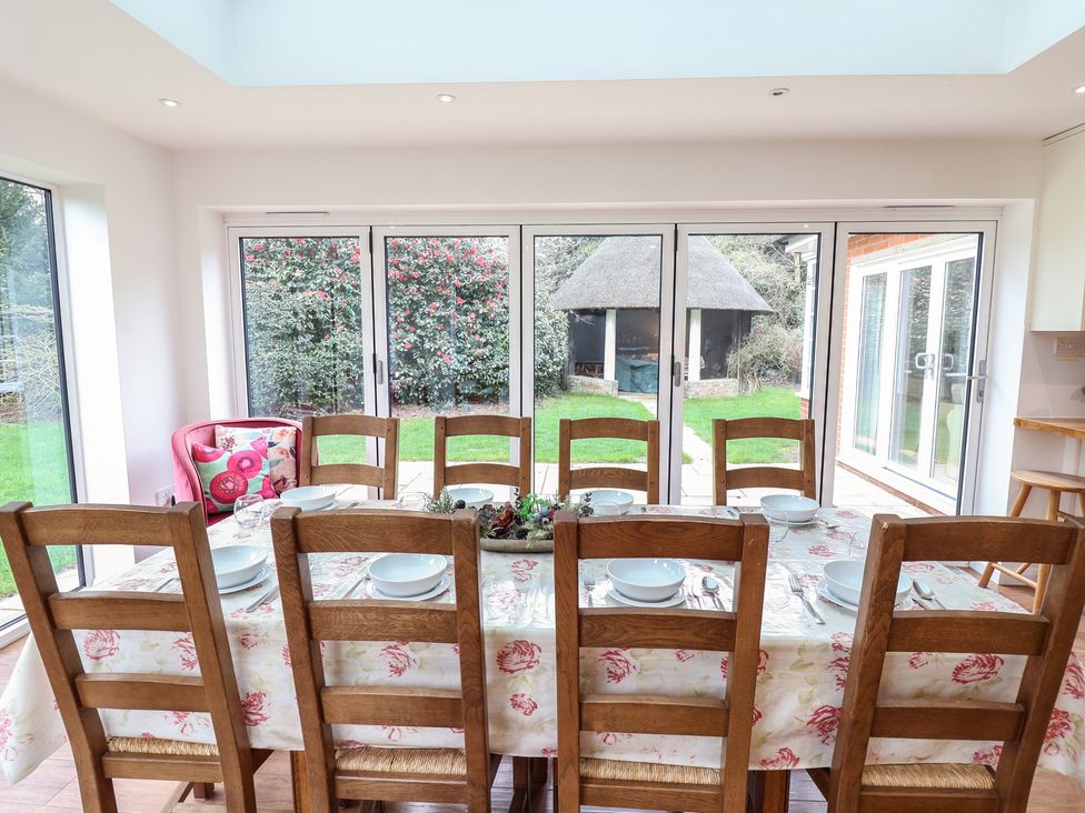 A dining room with a large table and chairs at Rippleway, Walberswick
