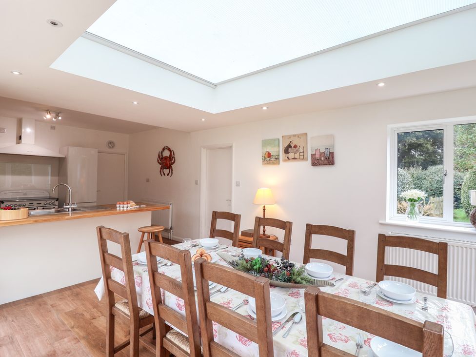 A dining room with a table and chairs at Rippleway, Walberswick