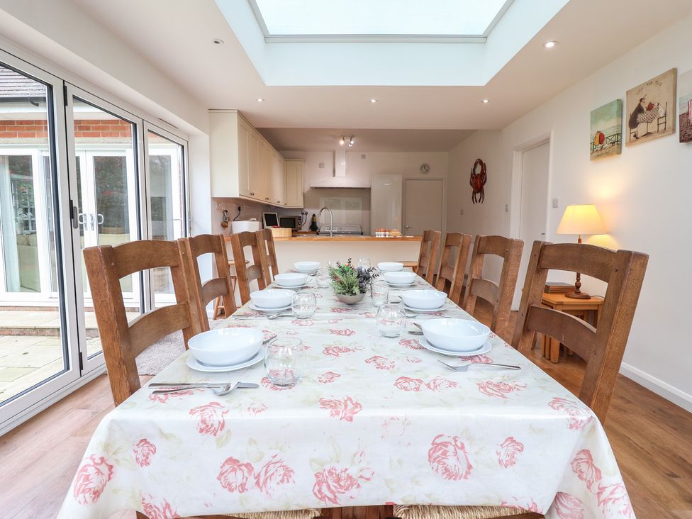 A dining room with a large table and chairs at Rippleway, Walberswick