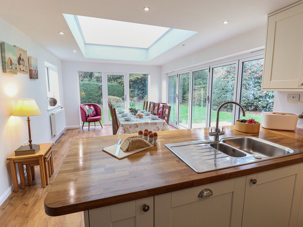 A kitchen with a dining table and chairs at Rippleway, Walberswick