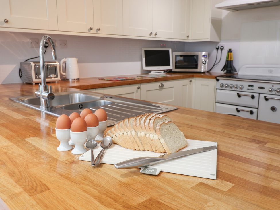 A kitchen with eggs and sliced bread on a counter at Rippleway, Walberswick