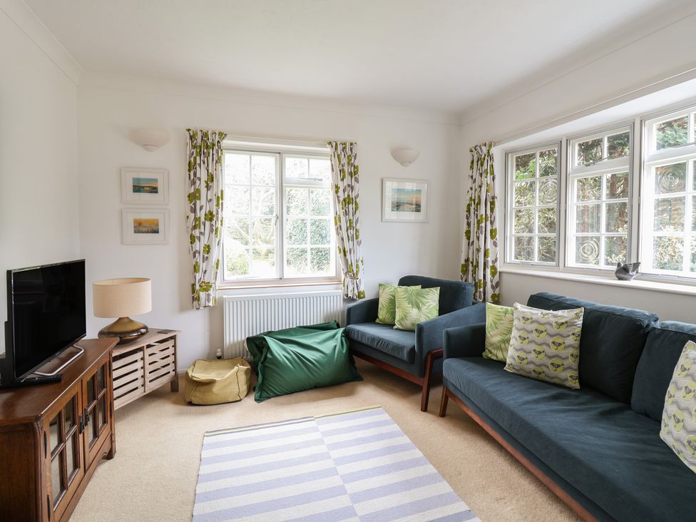 A living room with a sofa and television at Rippleway, Walberswick