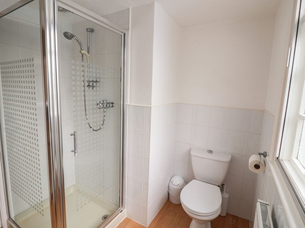 A bathroom with a shower and toilet at Rippleway, Walberswick