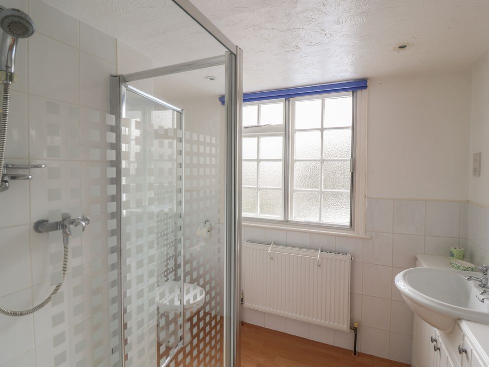A bathroom with a shower and sink at Rippleway, Walberswick