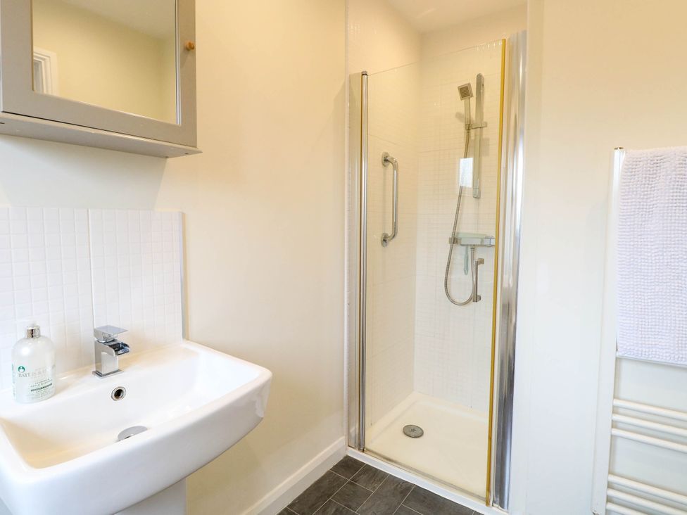 A bathroom with shower and sink at The Mulberry, nr Bungay