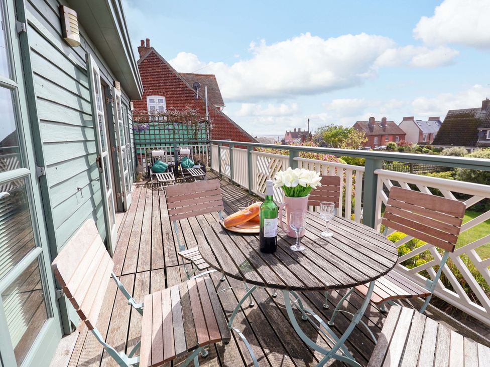 An outdoor terrace with a table and chairs at Robert Sadler's Studio Aldeburgh