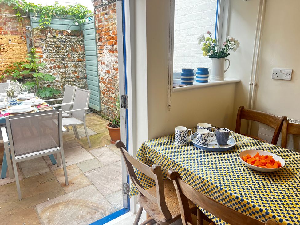 A dining room with a table and chairs at Seaflower, Aldeburgh