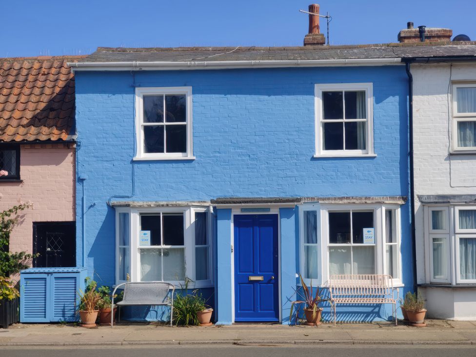 A blue house with a blue door and windows at Seaflower, Aldeburgh