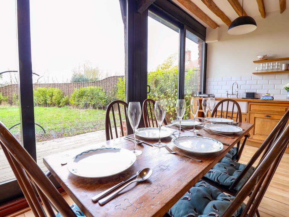 A dining room with table and chairs at Fishpond House, Sotherton