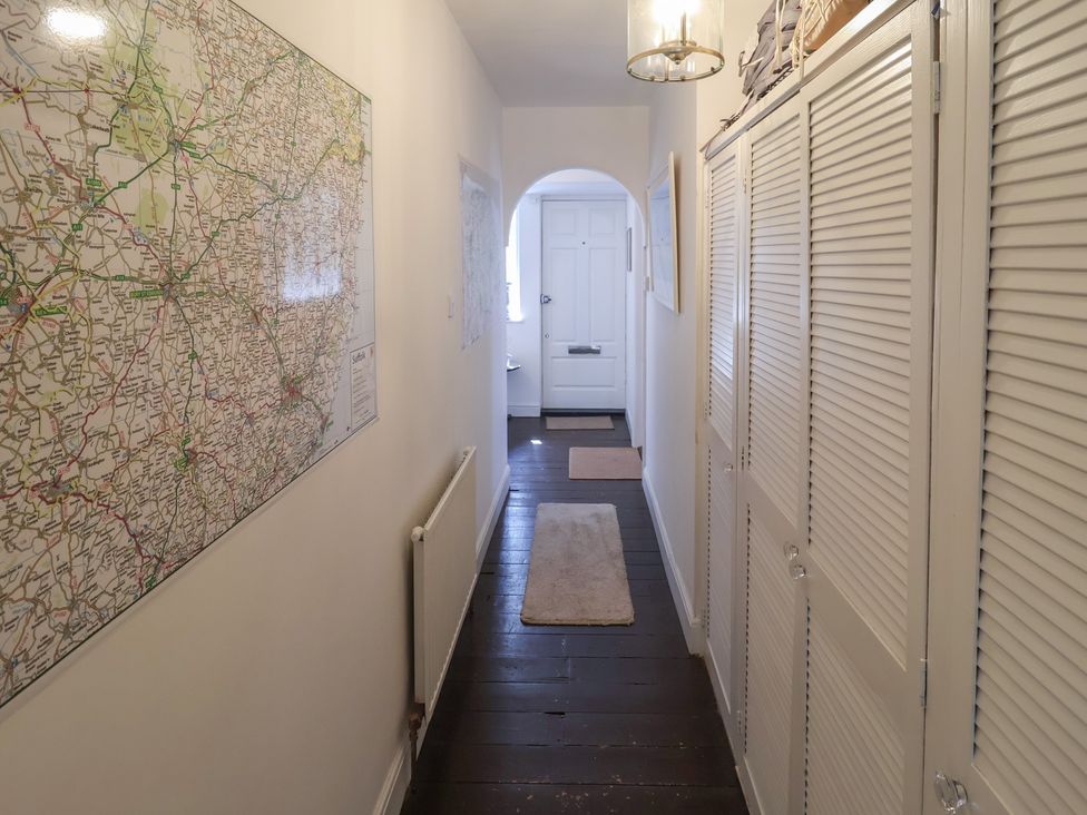 A hallway with a map on the wall at High Ground, Reydon