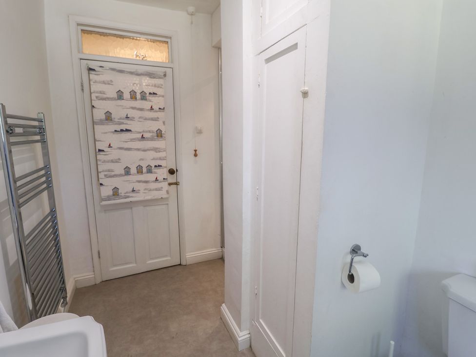 A bathroom with a towel radiator and a toilet at High Ground, Reydon