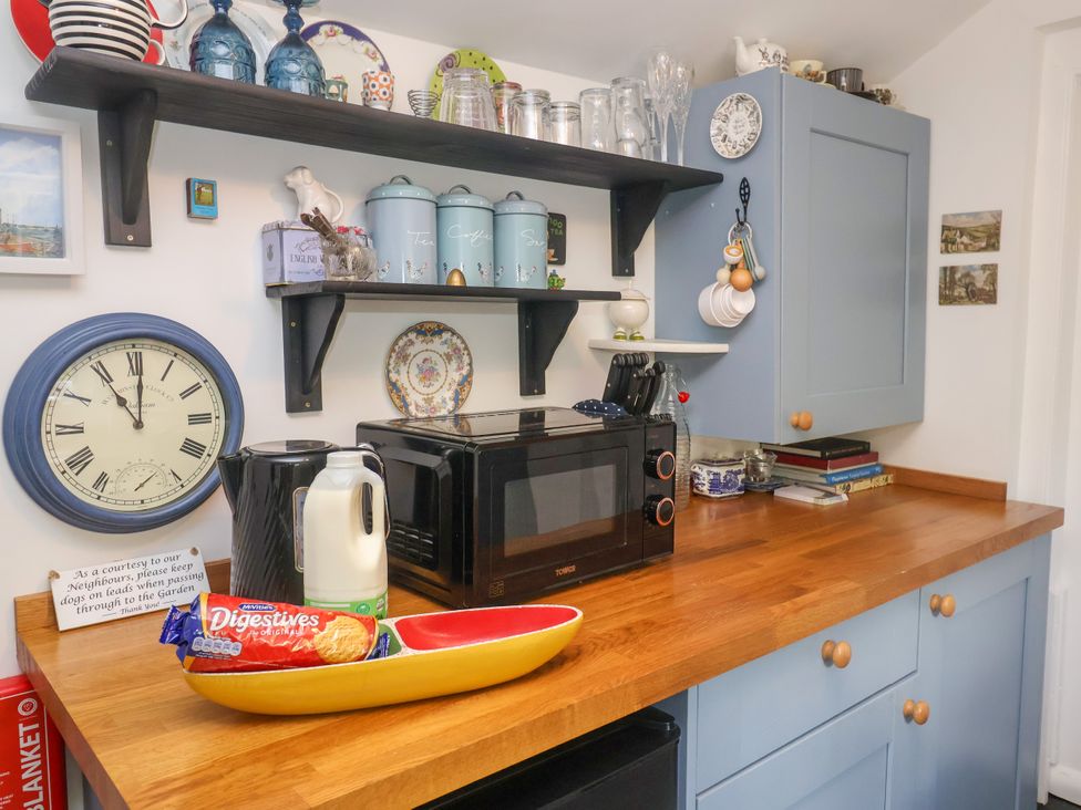A kitchen with a microwave and kettle at Cherry Tree Cottage, Woodbridge