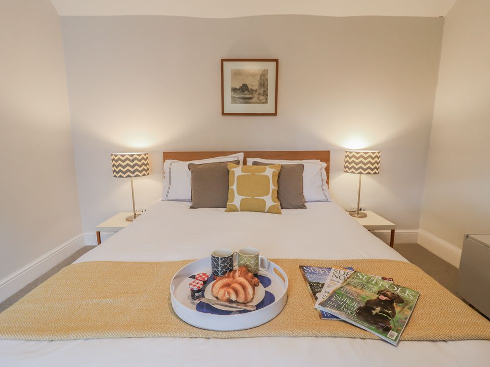 A bedroom with a bed and coffee on a tray at Fig Cottage, Pettistree Near Woodbridge