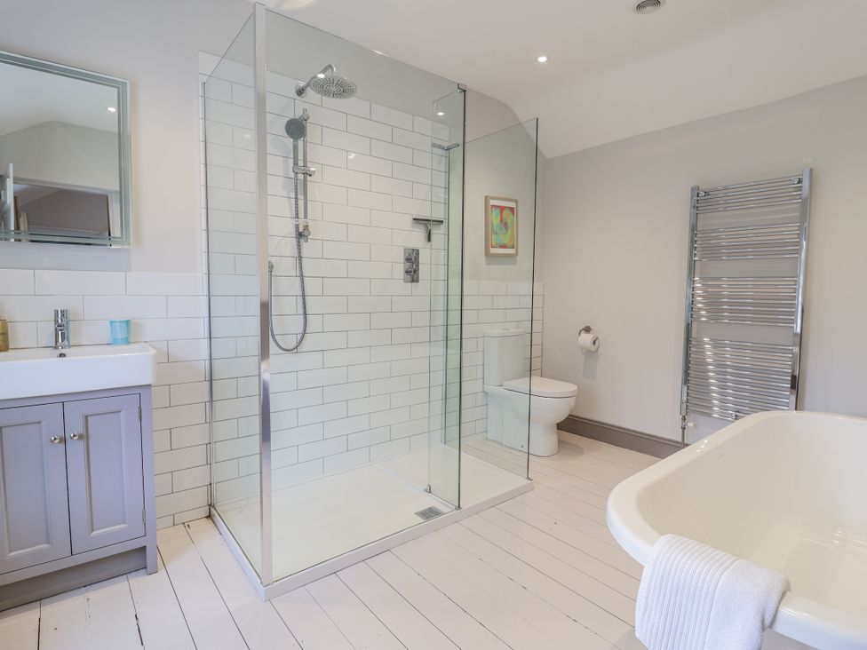 A bathroom with a shower, toilet, sink, and bathtub at Fig Cottage, Pettistree Near Woodbridge
