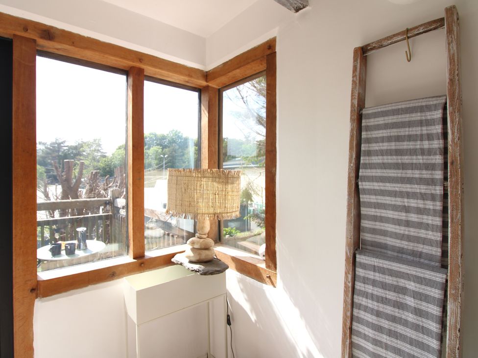 A corner with a lamp and shelf at West Island in Kingsbridge