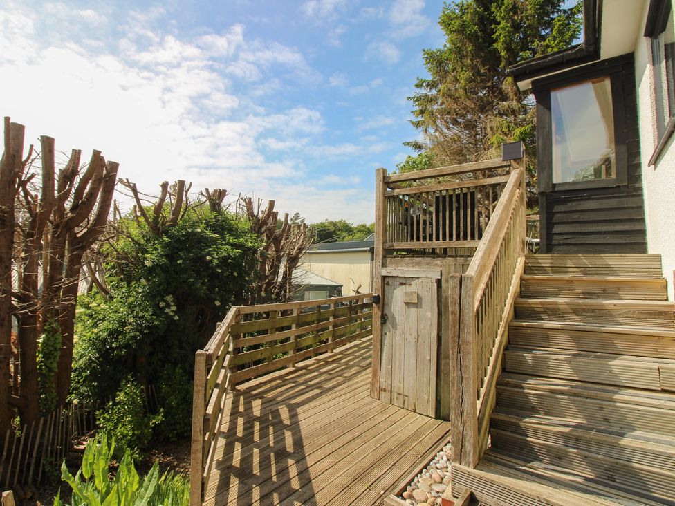An outdoor area with wooden stairs and decking at West Island in Kingsbridge