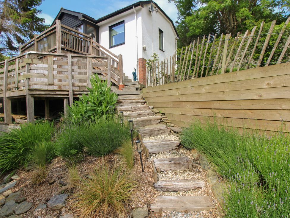 A garden with steps leading to a house at West Island in Kingsbridge