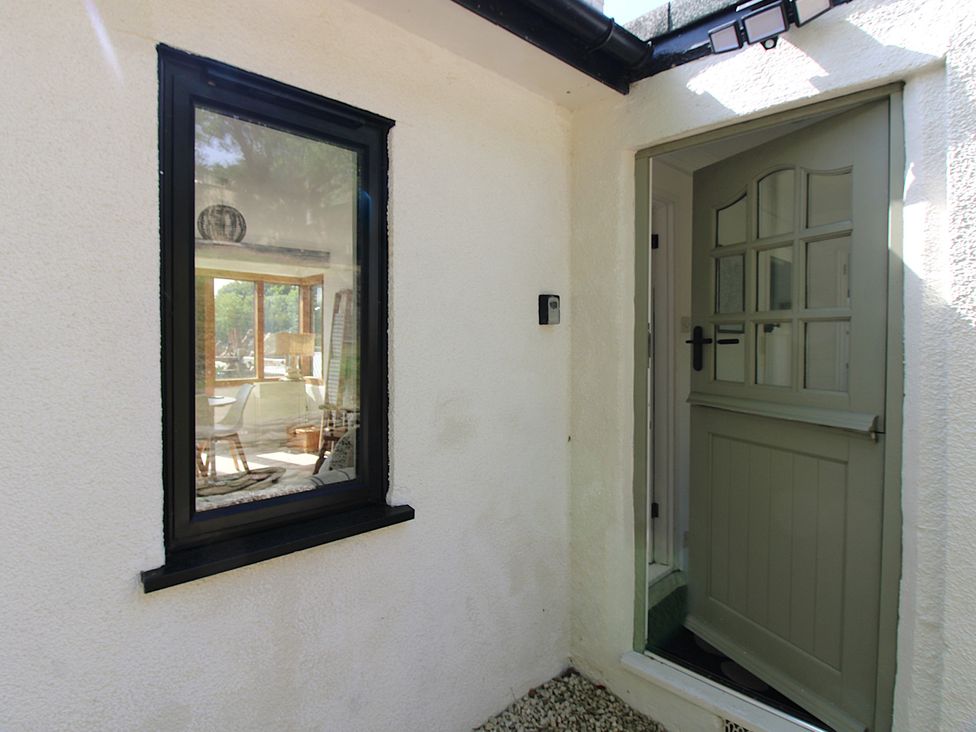 An entrance area with a door and window at West Island in Kingsbridge