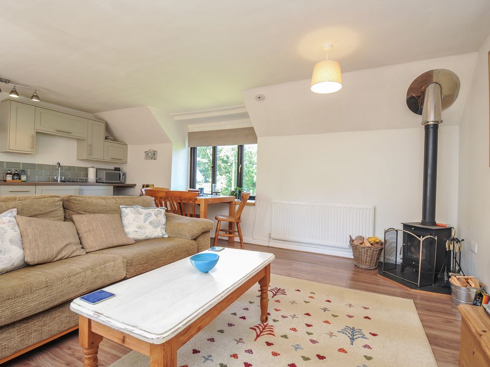 A living room with a sofa and coffee table at The Mews in Blisland