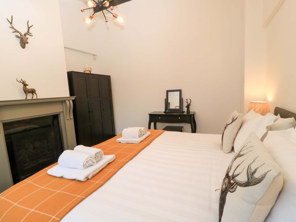 A bedroom with a bed and decorative items at The Annex in Wimborne Minster