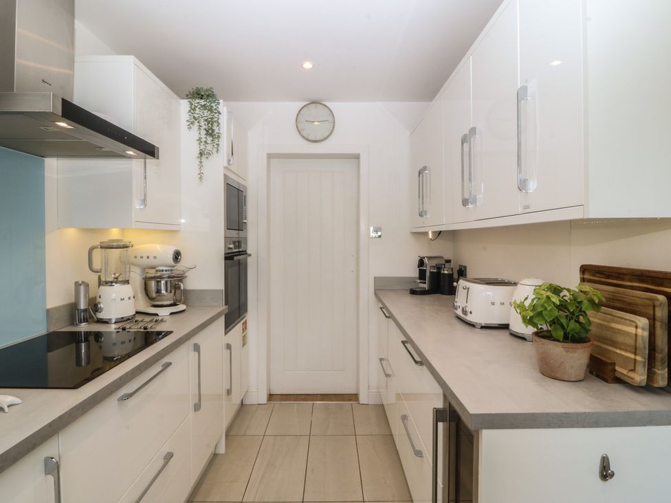 A kitchen with appliances and utensils at Trem Ynys near Abersoch