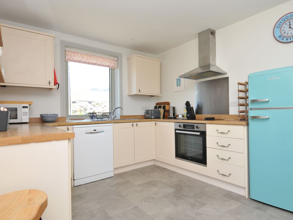 A kitchen with modern appliances at The Lookout in Polzeath
