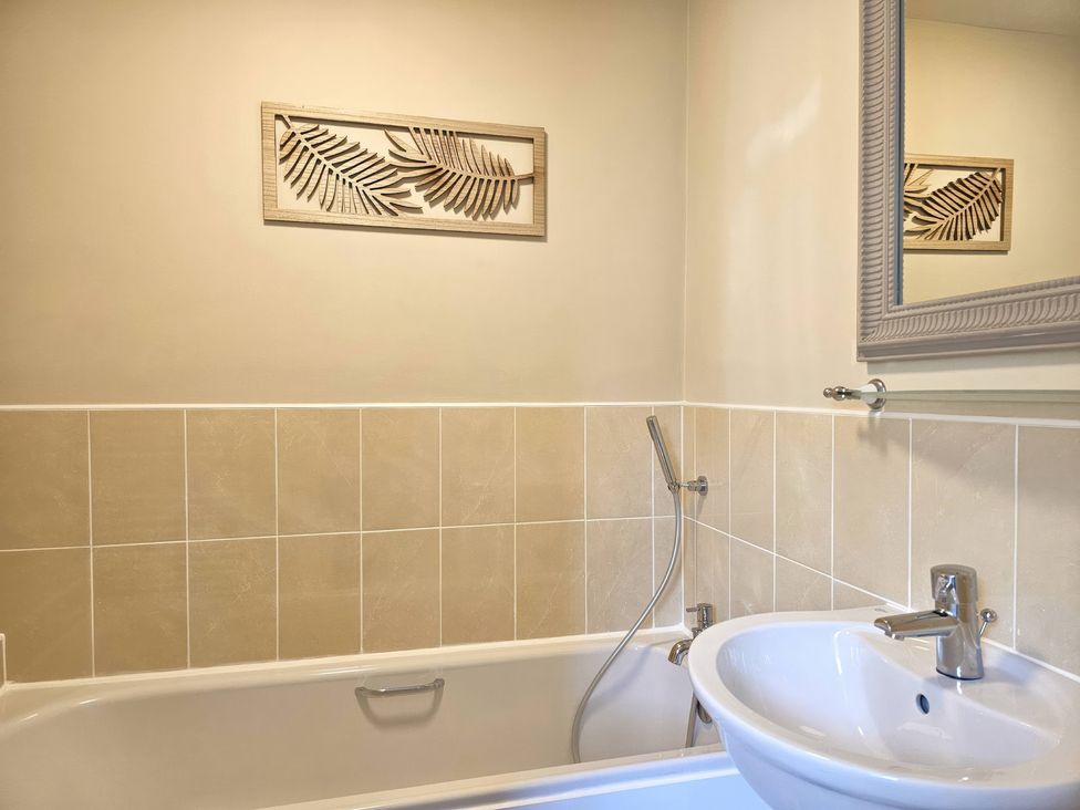 A bathroom with a bathtub and sink at The Milne in Todmorden