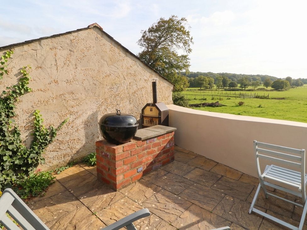 An outdoor area with a grill and chimney at The Old Tannery Beaumaris