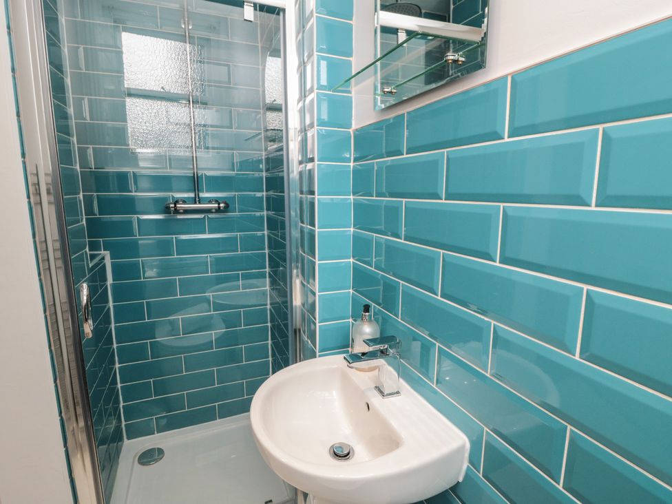 A shower and sink in a bathroom at Wellington House in Bridlington