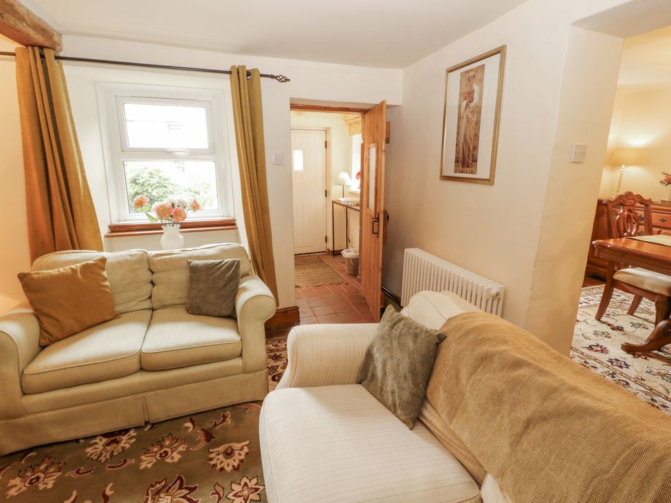A living room with a sofa and chair at White House in Shap