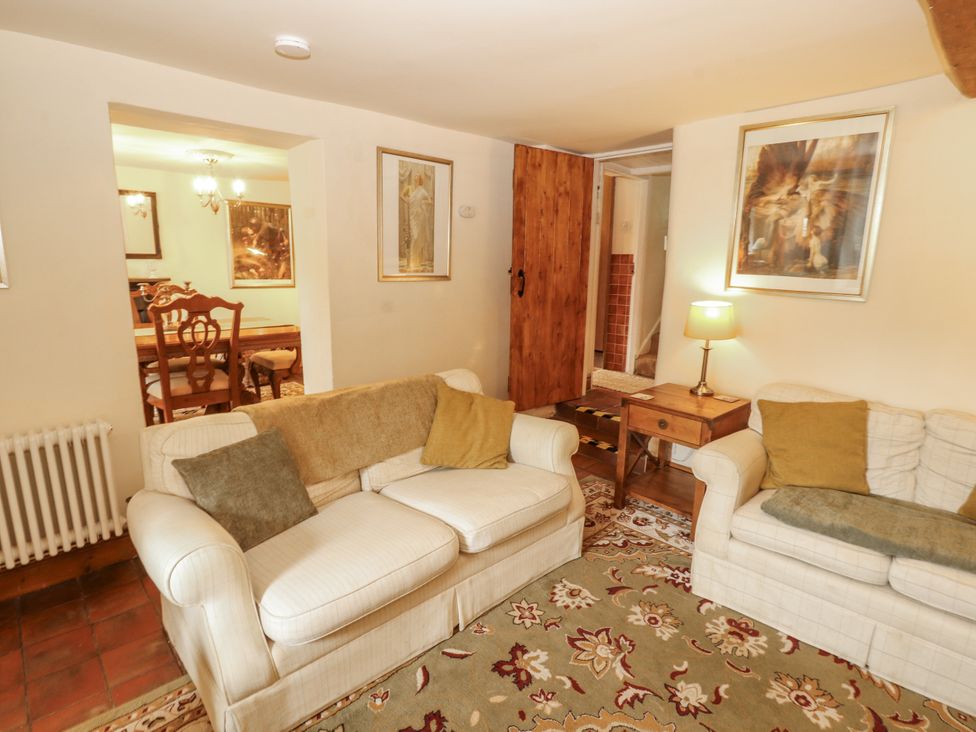 A living room with sofas and a table at White House in Shap