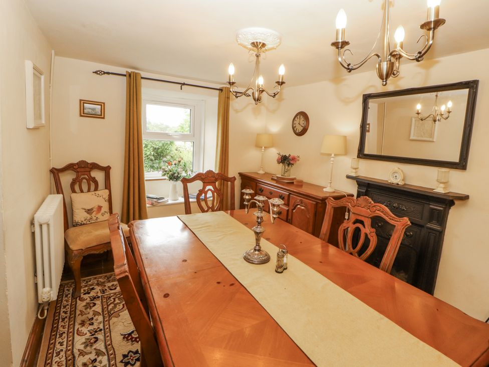 A dining room with a table and chairs at White House in Shap
