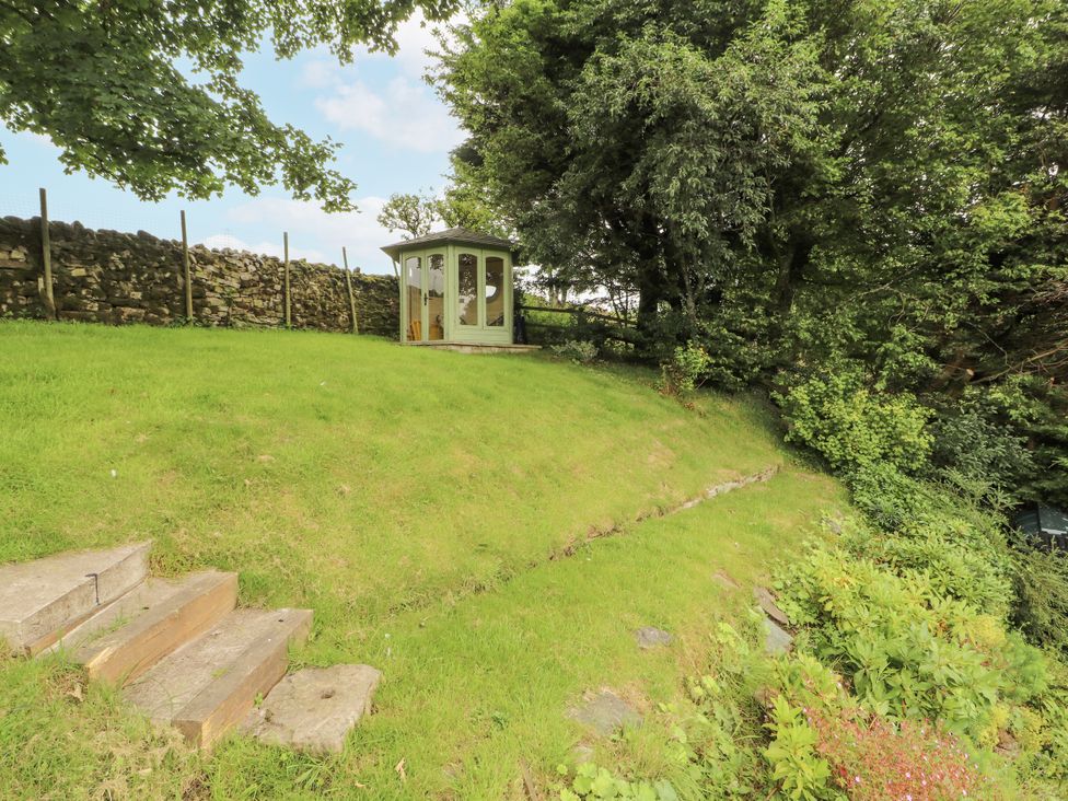 A garden with a summer house and steps at White House in Shap