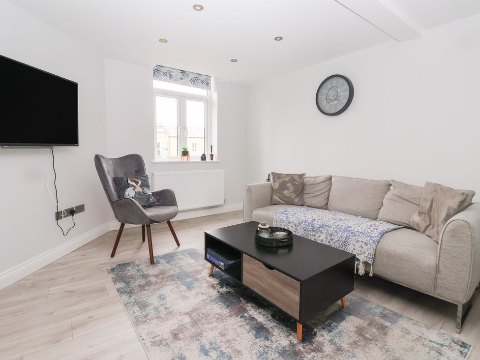A living room with a sofa and coffee table at Moor View in Skipton