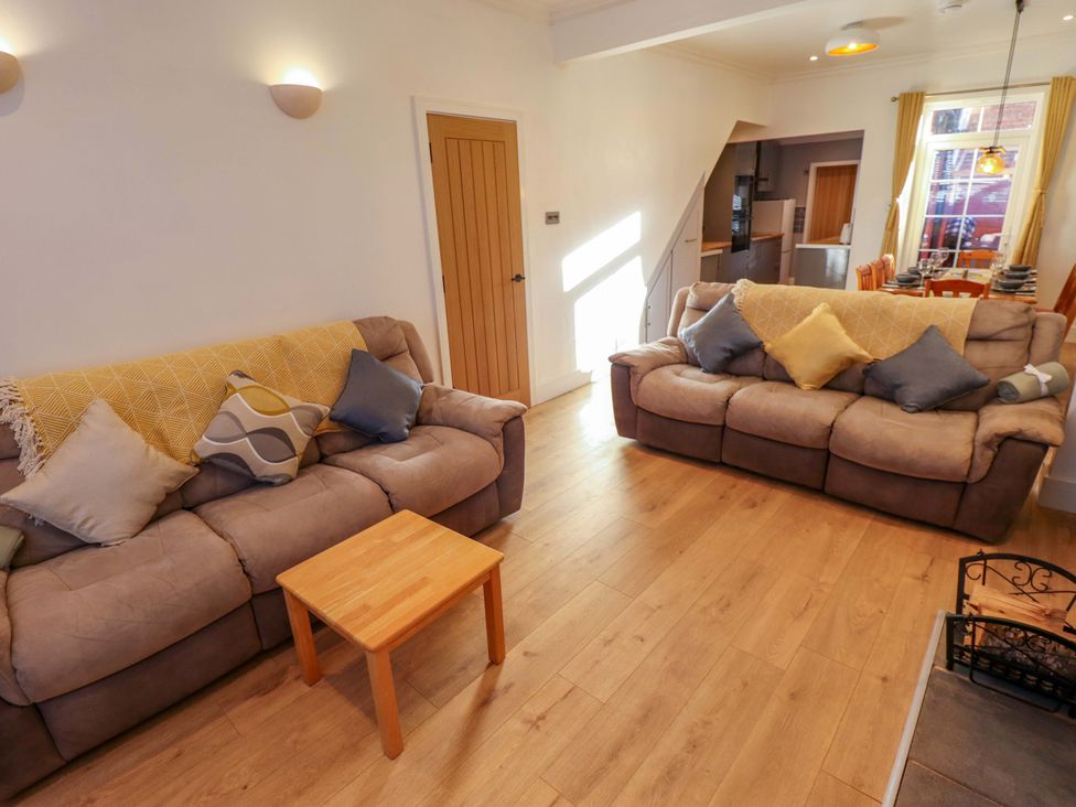A living room with sofas and a coffee table at 9 Alford Road