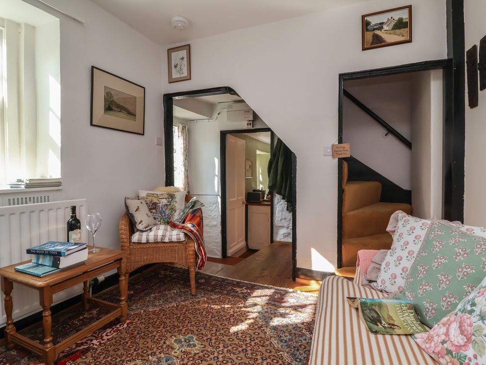 A living room with a sofa and coffee table at Blackbird Cottage Northam