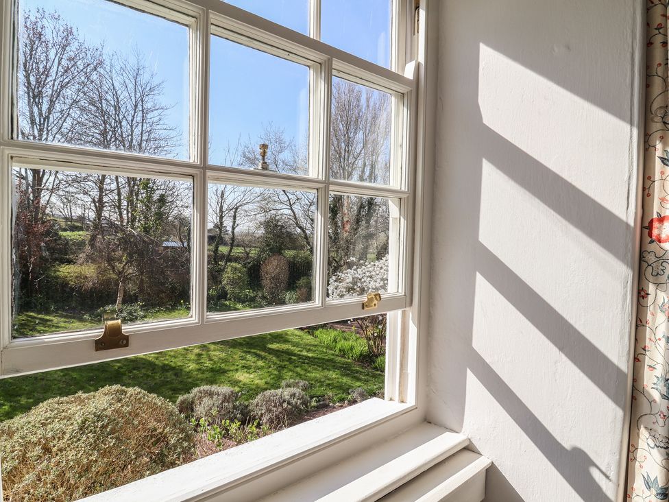 A window overlooking a garden at Blackbird Cottage Northam