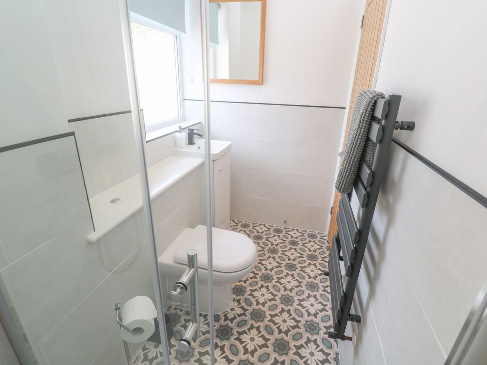 A bathroom with a toilet and sink at Foundry Cottage In Hayle Harbour, Hayle