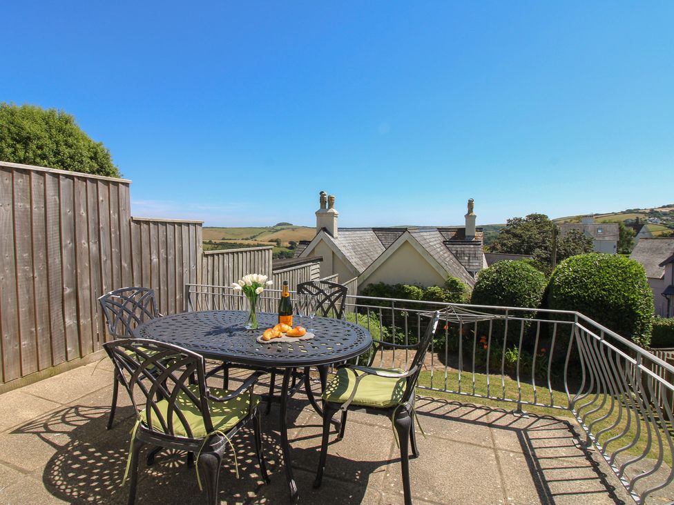 A table with drinks and pastries in an outdoor area at Waders in Salcombe