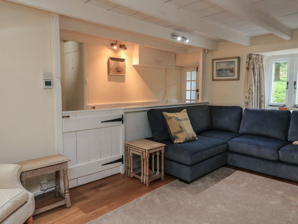 A living room with a sofa and side table at Wayside near Kingsbridge