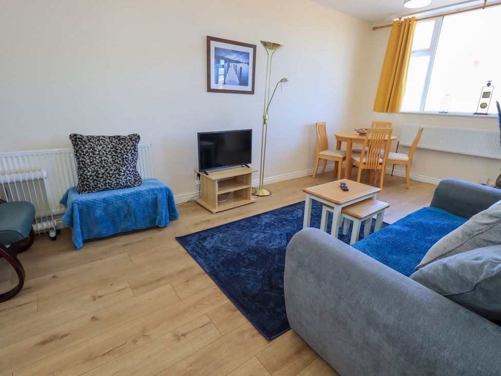 A living room with a sofa and coffee table at The Nest in Lytham St. Annes