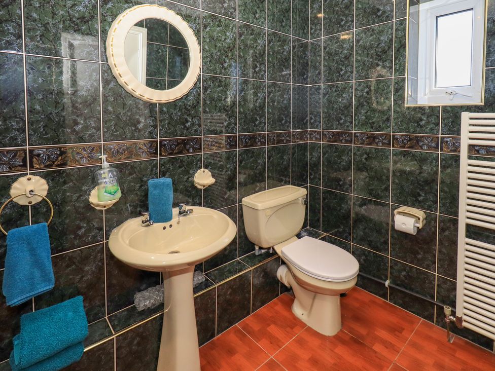 A bathroom with a sink and toilet at The Nest in Lytham St. Annes