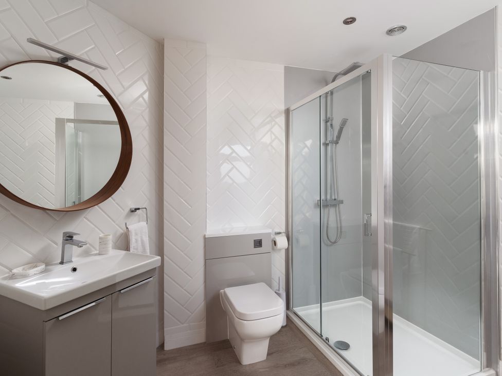 A bathroom with shower and washbasin at Estuary Watch in Lelant near Carbis Bay