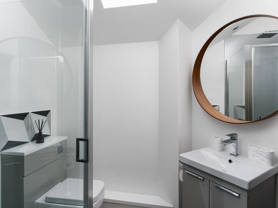 A bathroom with a shower and sink at Estuary Watch Lelant near Carbis Bay