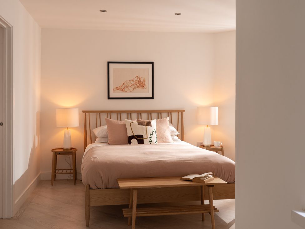 A bedroom with bed and lamps at Estuary Watch in Lelant near Carbis Bay